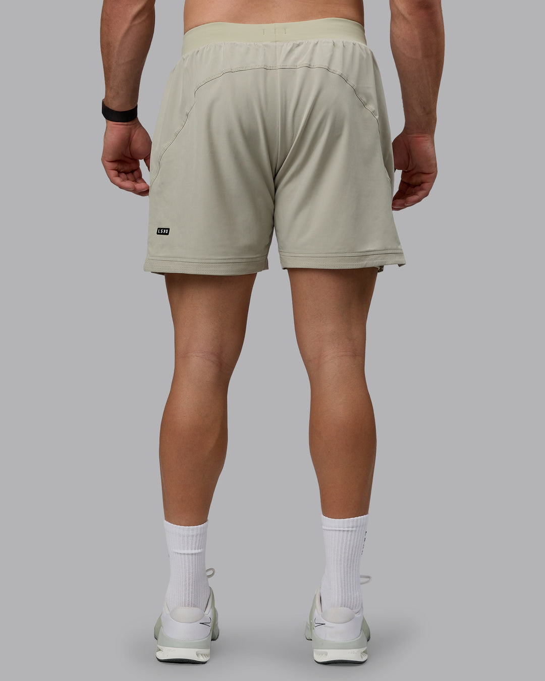 Man wearing Challenger 6" Lined Performance Shorts - Sustained Grey - view 4