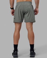 Man wearing Challenger 6" Performance Shorts - Graphite | Thumbnail Index: 3
