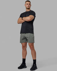 Man wearing Challenger 6" Performance Shorts - Graphite | Thumbnail Index: 4