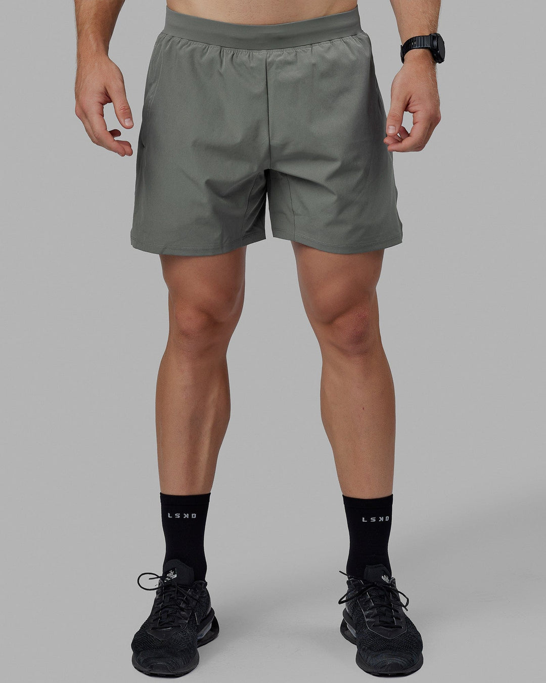 Man wearing Challenger 6" Performance Shorts - Graphite - view 3