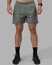 Man wearing Challenger 6" Performance Shorts - Graphite | Thumbnail Index: 2