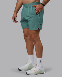 Man wearing Challenger 6" Performance Shorts - Sagebrush | Thumbnail Index: 0