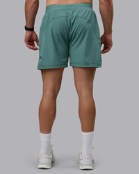 Man wearing Challenger 6" Performance Shorts - Sagebrush | Thumbnail Index: 3