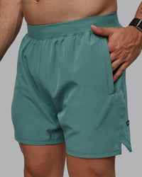 Man wearing Challenger 6" Performance Shorts - Sagebrush | Thumbnail Index: 1