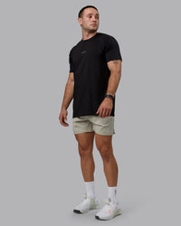 Man wearing Challenger 6" Performance Shorts - Sustained Grey | Thumbnail Index: 4