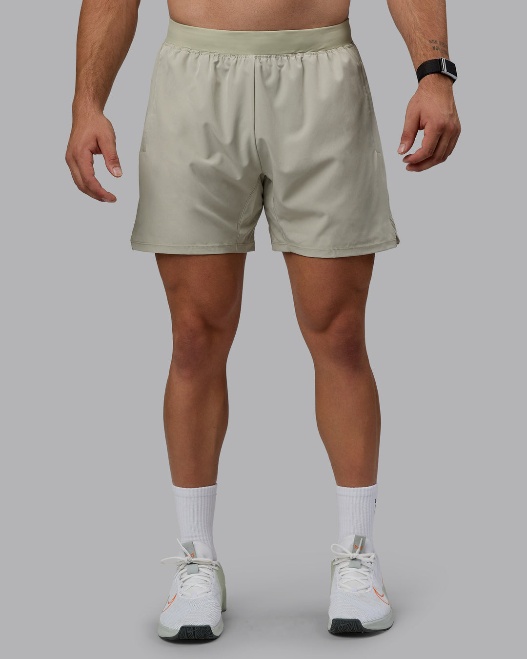 Man wearing Challenger 6" Performance Shorts - Sustained Grey - view 1
