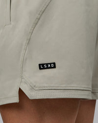 Man wearing Challenger 6" Performance Shorts - Sustained Grey | Thumbnail Index: 5