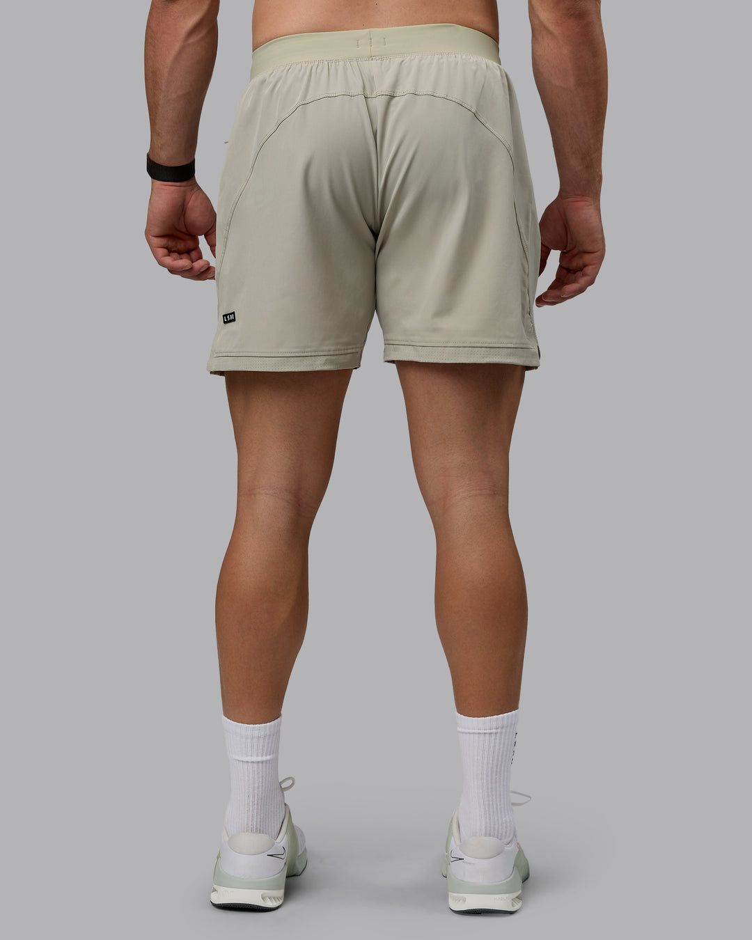 Man wearing Challenger 6" Performance Shorts - Sustained Grey - view 4