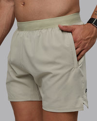 Man wearing Challenger 6" Performance Shorts - Sustained Grey | Thumbnail Index: 1