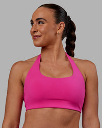 Woman wearing Challenger Sports Bra - Fuchsia Pink | Thumbnail Index: 2