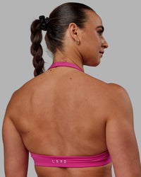 Woman wearing Challenger Sports Bra - Fuchsia Pink | Thumbnail Index: 0