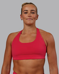 Woman wearing Challenger Sports Bra - Scarlet | Thumbnail Index: 4