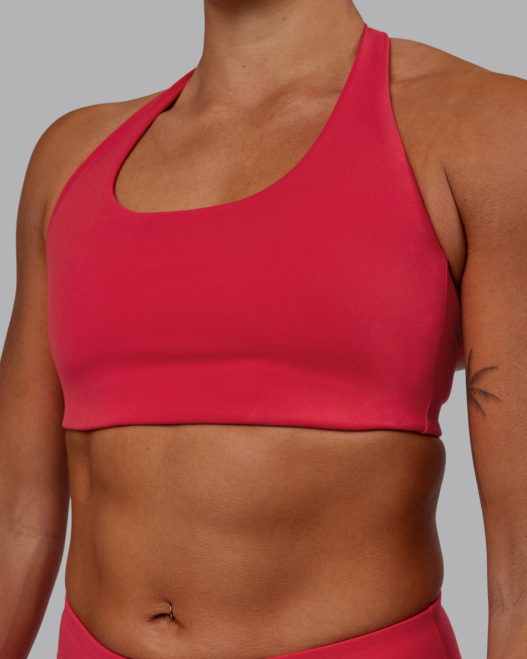 Woman wearing Challenger Sports Bra - Scarlet - view 7