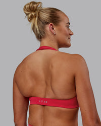 Woman wearing Challenger Sports Bra - Scarlet | Thumbnail Index: 0