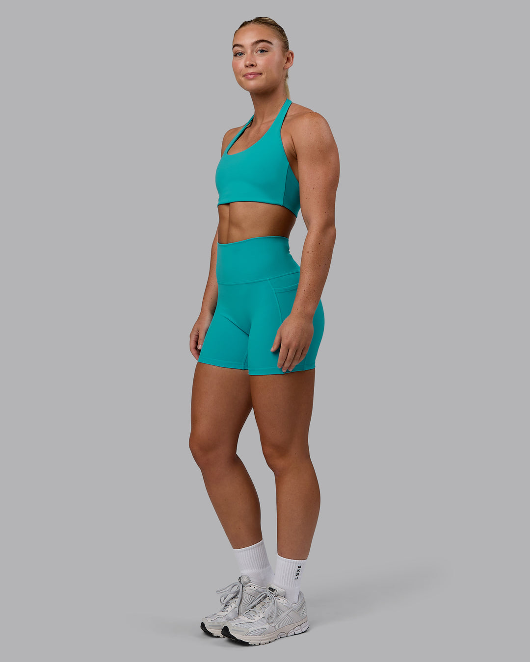 Woman wearing Challenger Sports Bra - Uplift Blue - view 5