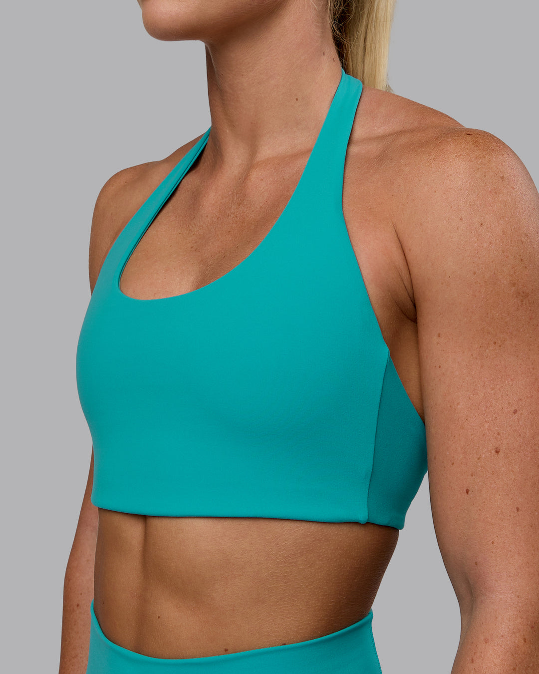 Woman wearing Challenger Sports Bra - Uplift Blue - view 4