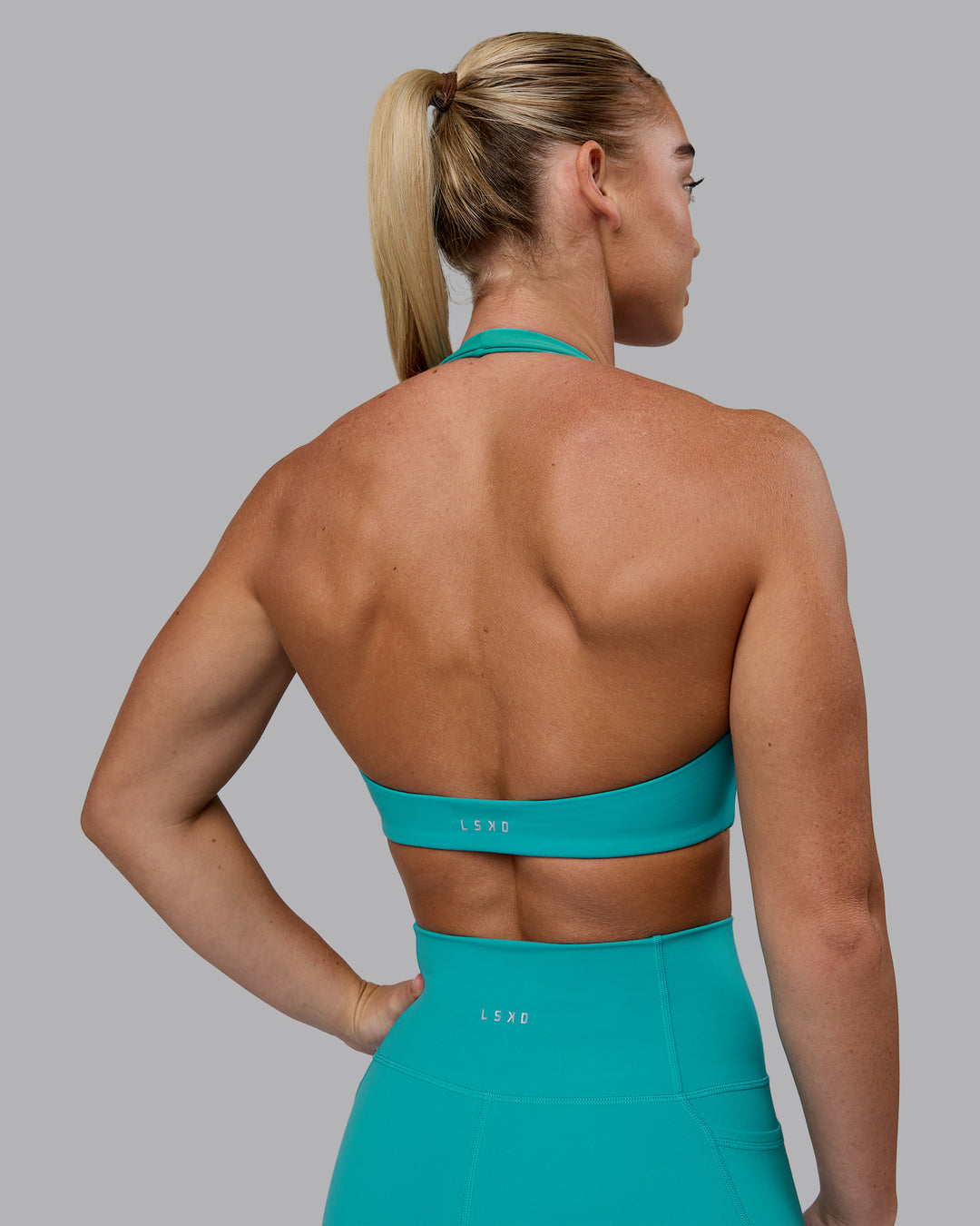 Woman wearing Challenger Sports Bra - Uplift Blue - view 7