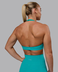 Woman wearing Challenger Sports Bra - Uplift Blue | Thumbnail Index: 6