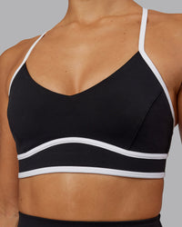 Woman wearing Contrast Sports Bra - Black-White | Thumbnail Index: 4