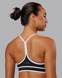 Woman wearing Contrast Sports Bra - Black-White | Thumbnail Index: 1