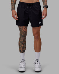 Man wearing Daily 5" Shorts - Black-White | Thumbnail Index: 1