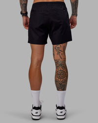 Man wearing Daily 5" Shorts - Black-White | Thumbnail Index: 3