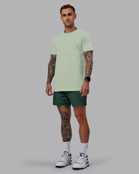 Man wearing Daily 5" Shorts - Cilantro | Thumbnail Index: 4