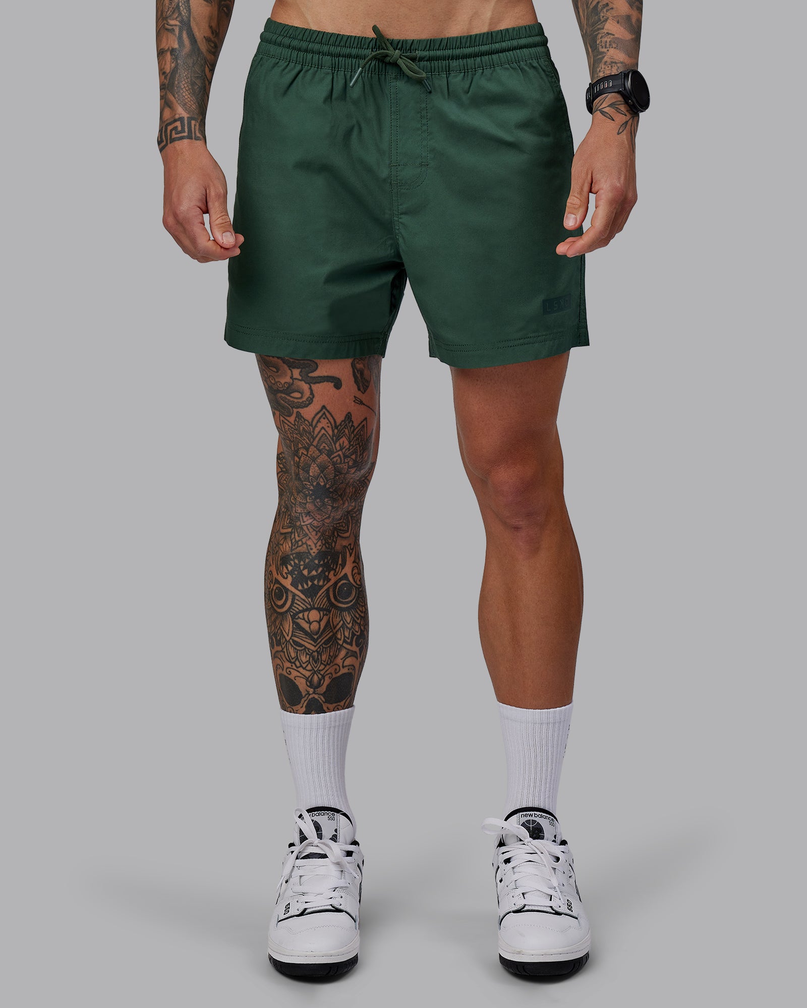 Man wearing Daily 5" Shorts - Cilantro