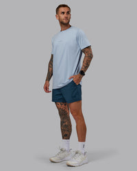 Man wearing Daily 5" Shorts - Indigo | Thumbnail Index: 1