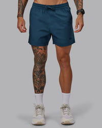 Man wearing Daily 5" Shorts - Indigo | Thumbnail Index: 0