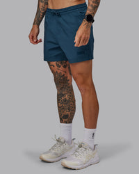 Man wearing Daily 5" Shorts - Indigo | Thumbnail Index: 5