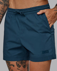 Man wearing Daily 5" Shorts - Indigo | Thumbnail Index: 2