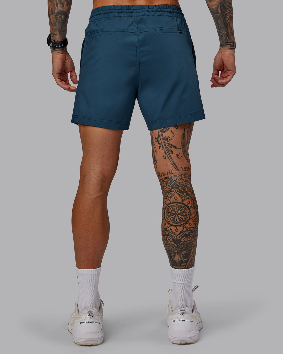 Man wearing Daily 5" Shorts - Indigo - view 4