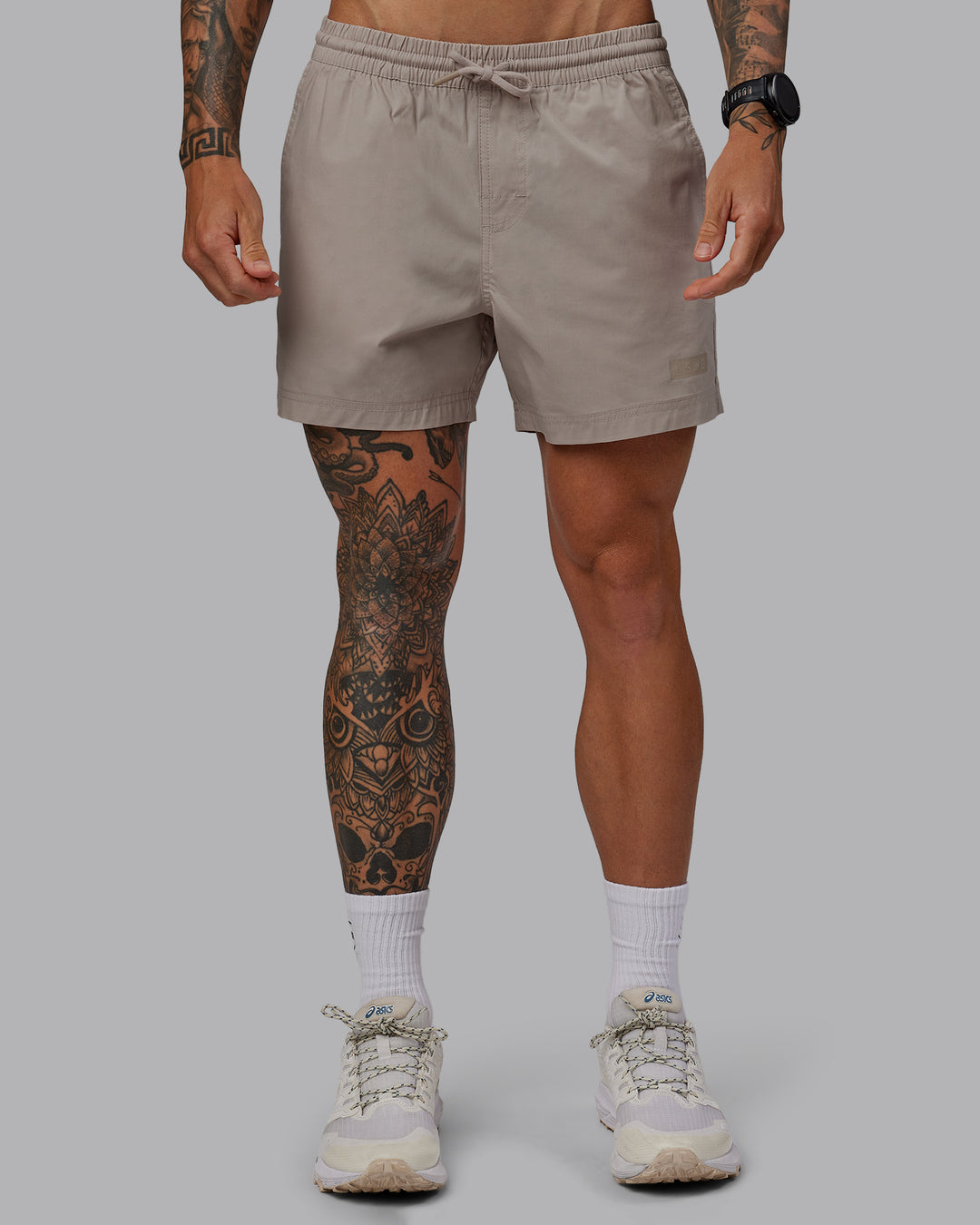 Man wearing Daily 5" Shorts - Shale Beige - view 1
