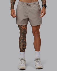 Man wearing Daily 5" Shorts - Shale Beige | Thumbnail Index: 0