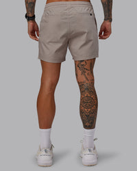 Man wearing Daily 5" Shorts - Shale Beige | Thumbnail Index: 3