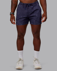 Man wearing Washed Daily 5" Shorts - Midnight Blue | Thumbnail Index: 0
