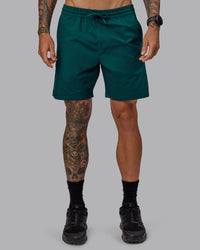 Man wearing Daily 7" Shorts - Dark Moss | Thumbnail Index: 5