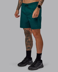 Man wearing Daily 7" Shorts - Dark Moss | Thumbnail Index: 0