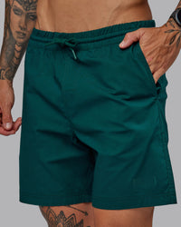 Man wearing Daily 7" Shorts - Dark Moss | Thumbnail Index: 2