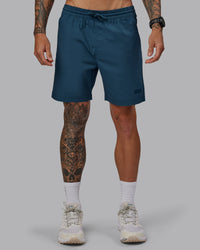 Man wearing Daily 7" Shorts - Indigo | Thumbnail Index: 0
