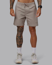 Man wearing Daily 7" Shorts - Shale Beige | Thumbnail Index: 0