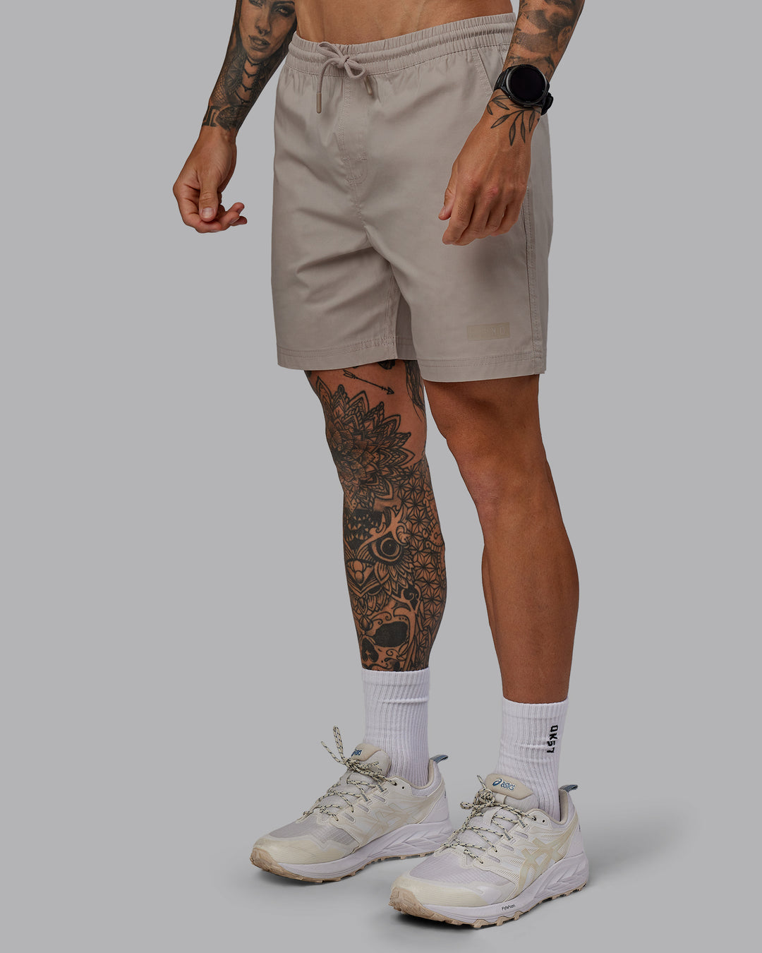 Man wearing Daily 7" Shorts - Shale Beige - view 6