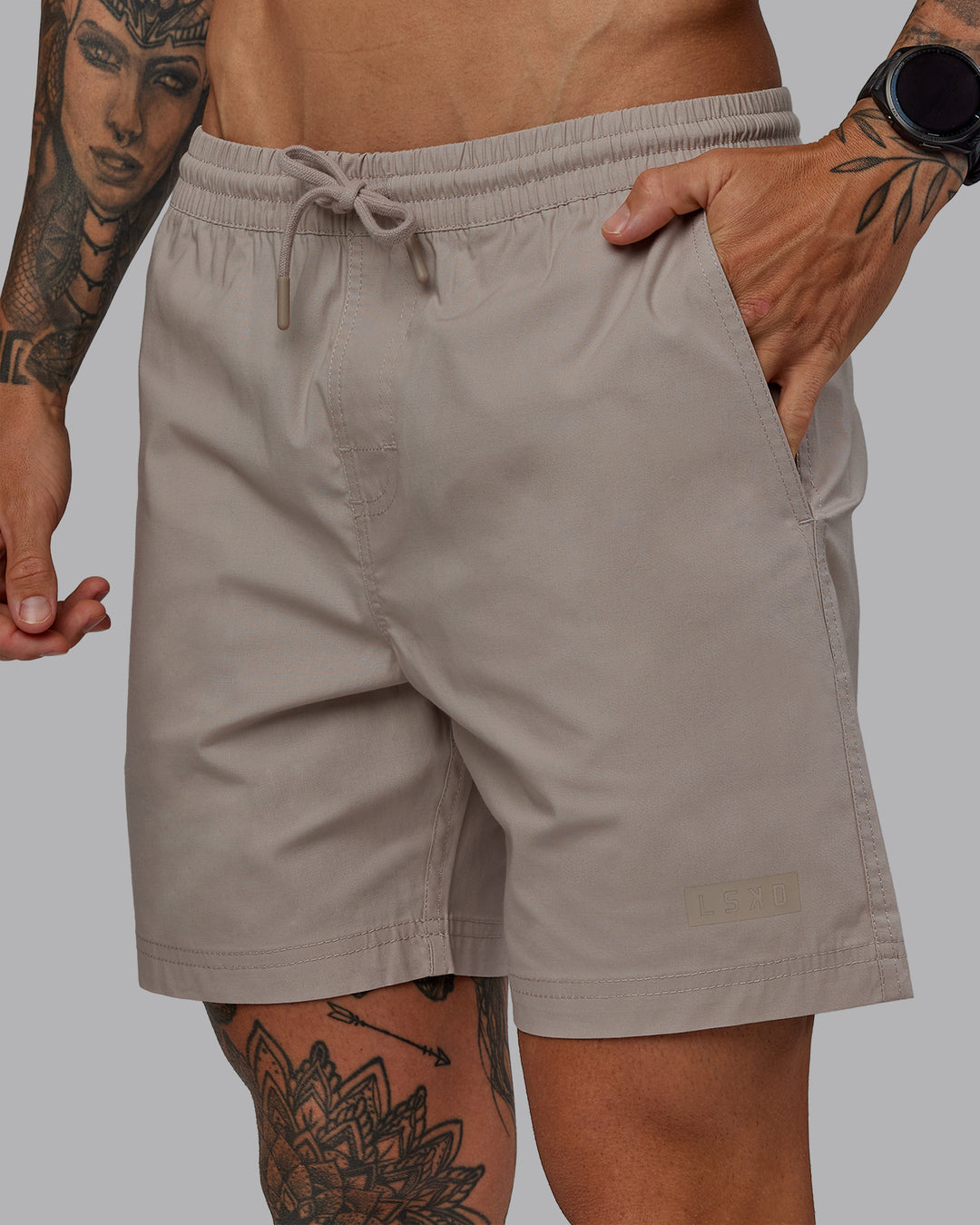 Man wearing Daily 7" Shorts - Shale Beige - view 3