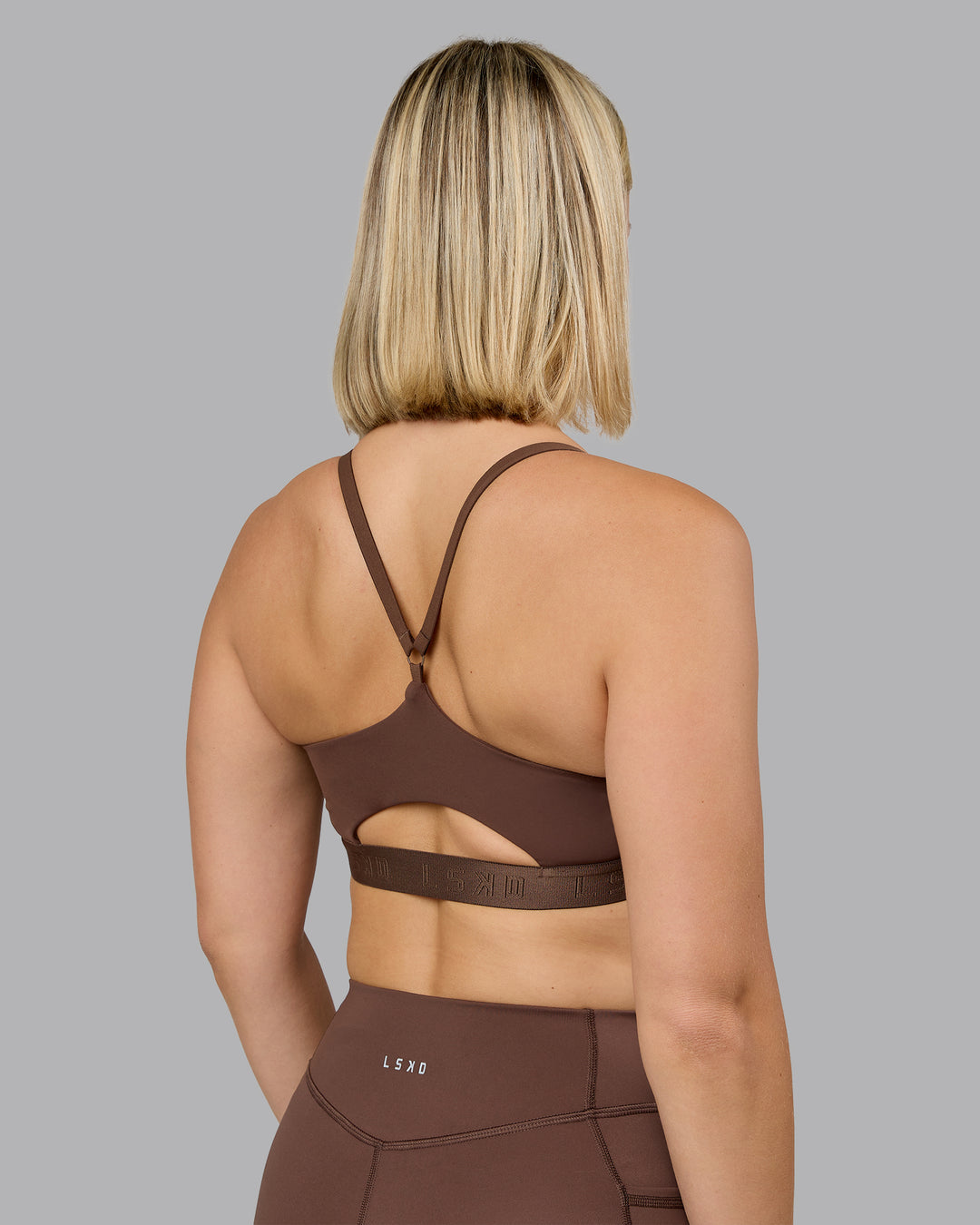 Woman wearing Define Sports Bra - Chocolate Martini | Model:Halle | Size:S - view 2