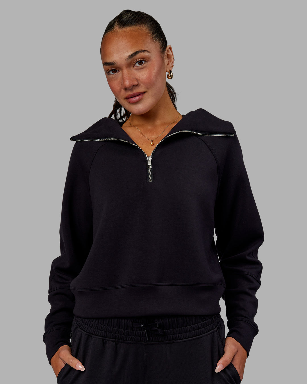 Woman wearing Elevate SoftTouch 1/2 Zip Sweater - Black-Black - view 1