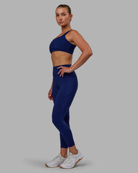 Woman wearing Elite High-Rise 7/8 Legging Pockets - Midnight Blue | Thumbnail Index: 6