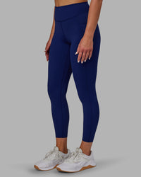 Woman wearing Elite High-Rise 7/8 Legging Pockets - Midnight Blue | Thumbnail Index: 8