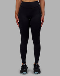 Woman wearing Elite High-Rise Full Length Legging Pockets - Black | Thumbnail Index: 0