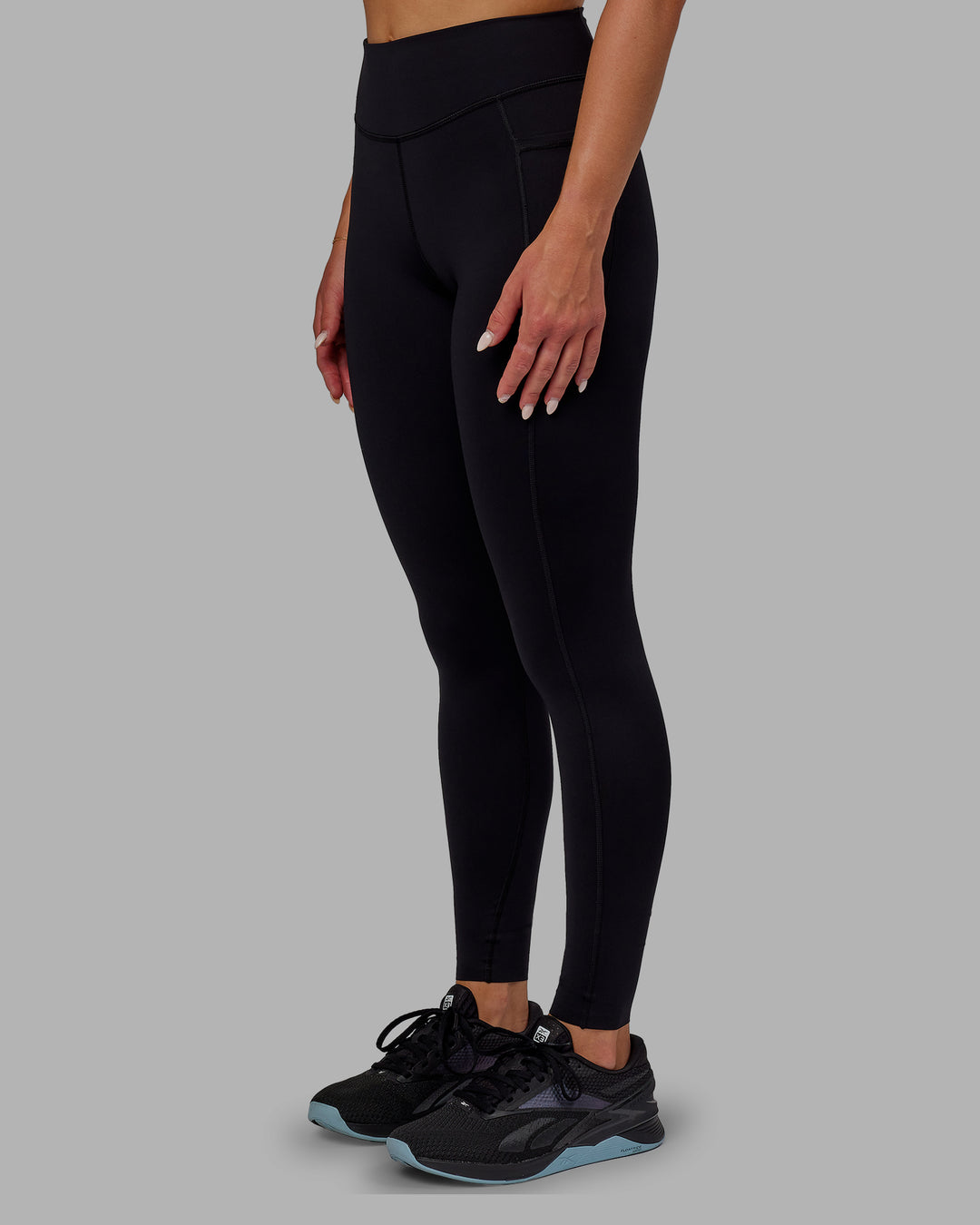 Woman wearing Elite High-Rise Full Length Legging Pockets - Black - view 6